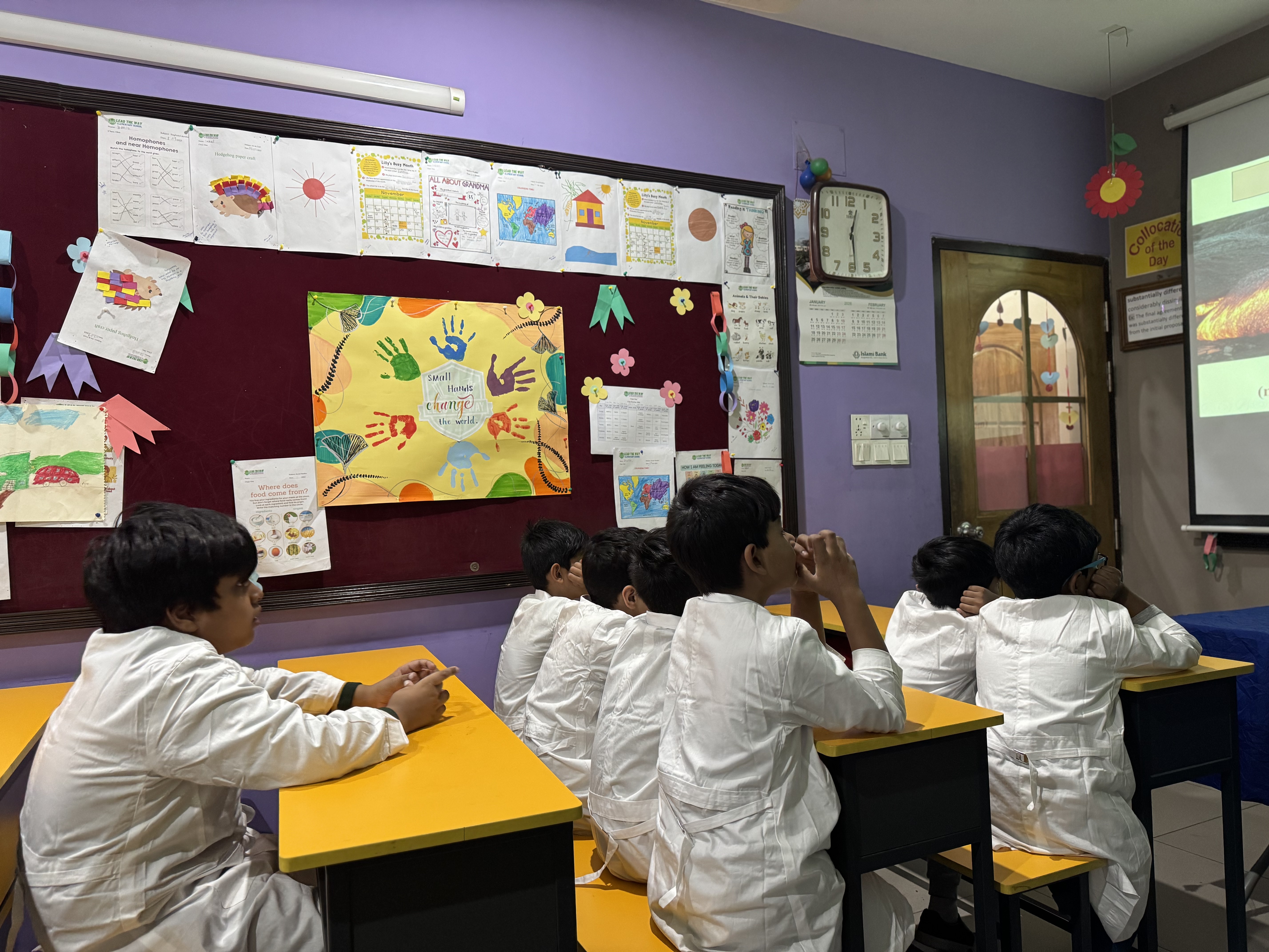 KG pupils engaged in interactive British phonics listening